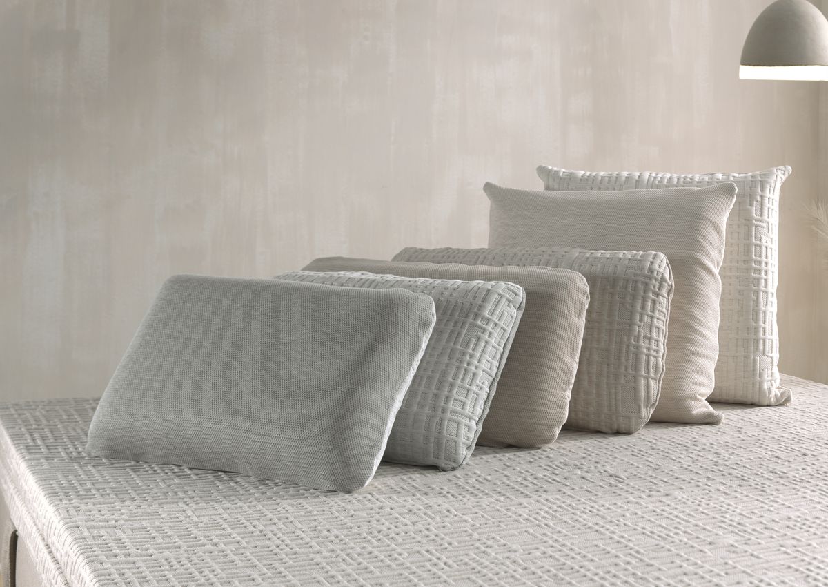 A row of pillows in different covers