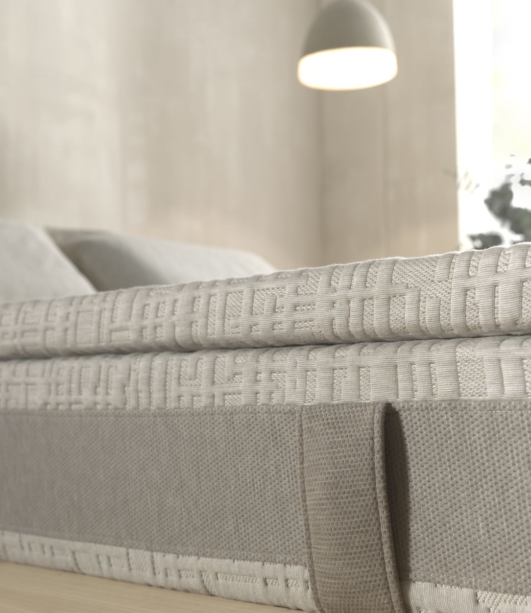 A textured topper on a mattress
